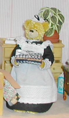Maid Teddy putting away the laundry